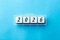 Loading 2026 concept with white blocks on a blue background. Minimalist flat lay symbolizing future planning, business goals. Royalty Free Stock Photo