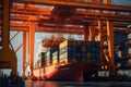 Loading a container ship at cargo berth of the seaport using port cranes. Containers are stacked and secured on board Royalty Free Stock Photo