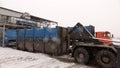 Loading the container with waste on a special machine .Recycling plant. Waste sorting and recycling business