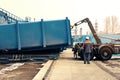 Loading container with waste to a special machine for subsequent transportation to a waste disposal plant. Waste