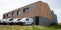 Loading delivery vans in front of cargo doors warehouse for delivery