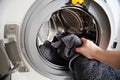 Loading dirty cloth in washing machine