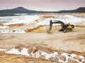 Loading excavators rest during weekend. Large mine on glass sand