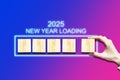 2025. Loading indicator, on a gradient purple-blue background. The concept of the onset of the New Year. Holidays. Royalty Free Stock Photo
