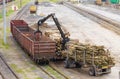 Loading Lumber Into Freight Train at Railway Yard During Daytime Royalty Free Stock Photo