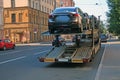 Loading of new cars onto a road train Royalty Free Stock Photo