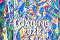 Loading 2022, phrase on the trendy colorful neon holographic background with polarization effect. Royalty Free Stock Photo