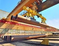 Loading pipes With Bridge Crane Royalty Free Stock Photo