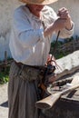 Loading a powder to the barrel of an antique shotgun