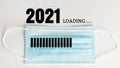 2021 loading progress with disposal face mask.