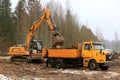 Loading Soil onto Sisu Truck with Liebherr R918 Crawler Excavator