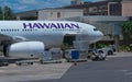 Loading and unloading planes at Honolulu Airport.