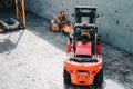 Loading and unloading process of steel coils in cargo port. Carry steel coils. View on procces into cargo hold. Copy space. Backgr Royalty Free Stock Photo