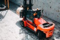 Loading and unloading process of steel coils in cargo port. Carry steel coils. View on procces into cargo hold. Copy space. Backgr Royalty Free Stock Photo