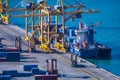 Loading, unloading on seagoing craft containers crane in the container terminal of the sea port Royalty Free Stock Photo