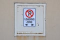 Loading zone sign