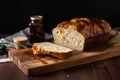 loaf of artisan bread, sliced and ready to be enjoyed with variety of spreads