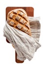 Loaf of bread on cutting board directly above, isolated on a white Royalty Free Stock Photo