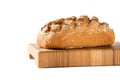 loaf of bread on cutting board, isolated on white Royalty Free Stock Photo