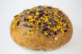 Loaf of bread with edible flowers and nuts Royalty Free Stock Photo