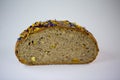 Loaf of bread with edible flowers and nuts Royalty Free Stock Photo