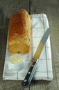 Loaf of bread with knife and butter Royalty Free Stock Photo