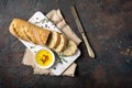 Loaf of bread with olive oil, vintage knife and spices Royalty Free Stock Photo