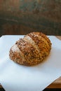 a loaf of bread on a paper towel on top of a table Royalty Free Stock Photo