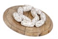 Loaf of bread with sausages on wooden plate