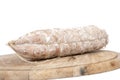 Loaf of bread with sausages on wooden plate