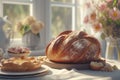 loaf of bread on the table, pies on a plate nearby and flowers by the blur window on a sunny day Royalty Free Stock Photo