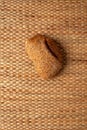 A loaf of bread on weave grass background showing texture. Royalty Free Stock Photo
