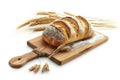 Loaf of bread and wheat ears on cutting board isolated on white Royalty Free Stock Photo