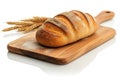 Loaf of bread and wheat ears on cutting board isolated on white Royalty Free Stock Photo