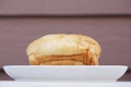 Loaf of bread on wooden background, food closeup Royalty Free Stock Photo