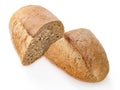 A loaf of brown bread cut in two pieces. On white background Royalty Free Stock Photo