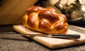 Loaf of challah bread with a knife Royalty Free Stock Photo