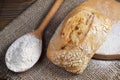 Loaf of ciabatta bread and a spoon with flour Royalty Free Stock Photo