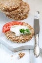 Crispbread with curd cheese and tomato on a white background Royalty Free Stock Photo