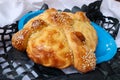 Loaf of Day of the Dead bread Pan de Muerto topped with sesame seeds for the Day of the Dead