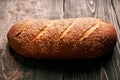 Loaf of fresh made white bread on wooden table background Royalty Free Stock Photo