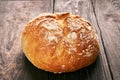 Loaf of fresh made white bread on wooden table background Royalty Free Stock Photo