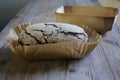 loaf of fresh rye bread in baking paper Royalty Free Stock Photo