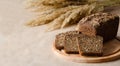 A loaf of fresh rye bread and three slices on a board. Royalty Free Stock Photo