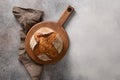 Loaf of freshly baked bread on brown background. Royalty Free Stock Photo