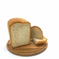 A loaf of freshly baked wheat bread with a golden crust and porous crumb on a round wooden board. Royalty Free Stock Photo