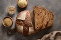 Loaf of gluten-free bread with hemp flour on brown background. Artisan bread. View from above. Royalty Free Stock Photo