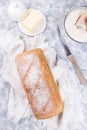 Loaf of homemade no knead sandwich bread with knife and butter, vertical, top view Royalty Free Stock Photo