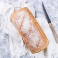 Loaf of homemade no knead sandwich bread with knife, top view, square format Royalty Free Stock Photo