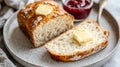 A loaf of homemade sourdough bread with a slice topped with butter and Royalty Free Stock Photo
